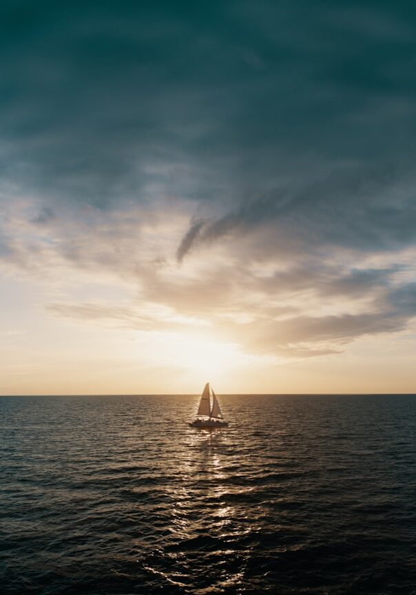 Photo by Josh Sorenson sailboat on body of water